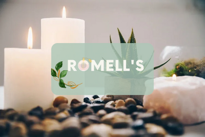 Candles with romell's logo